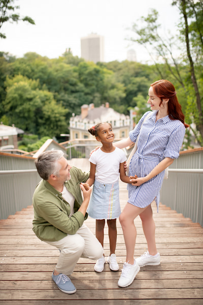 old couple and their new adopted child | Myth: Adoptive Parents Should Be Young