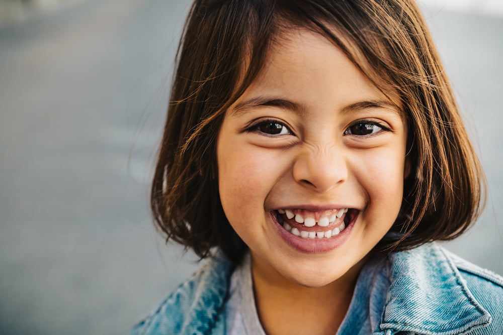 Waiting Children in Ohio foster care : a photo of a young girl smiling at the camera