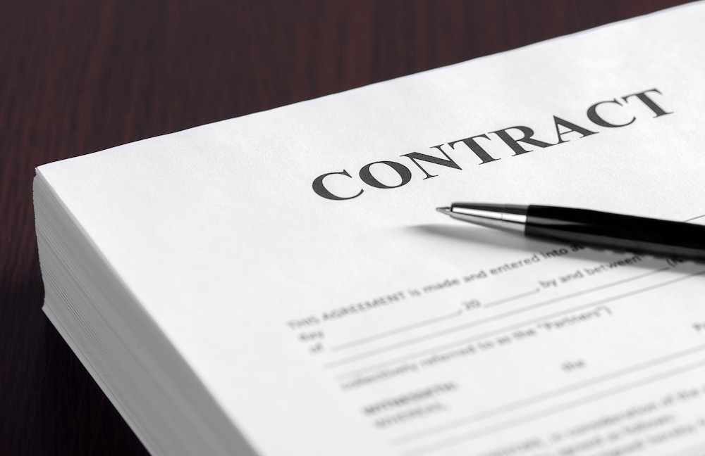 contract and a pen on Legal Aspects for adoption