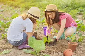 two children planting