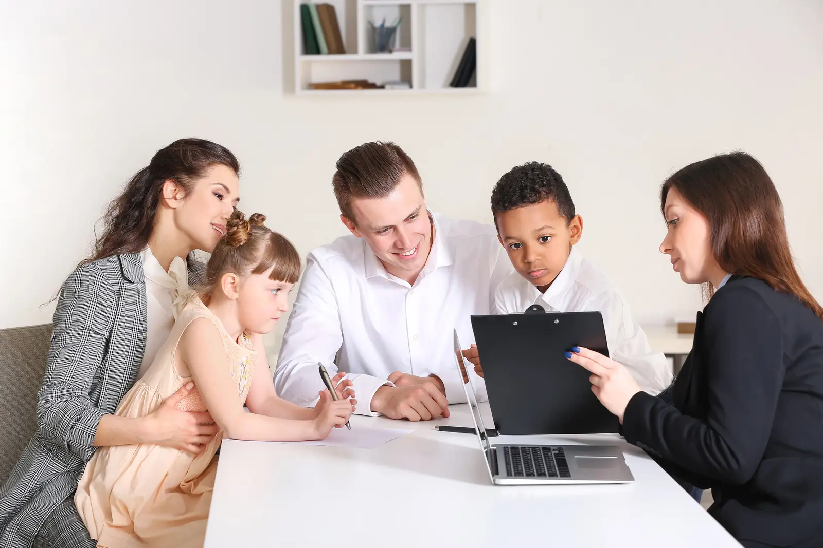 a couple with their adopted children consulting with a professional