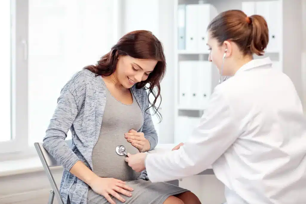 doctor checking up the pregnant woman