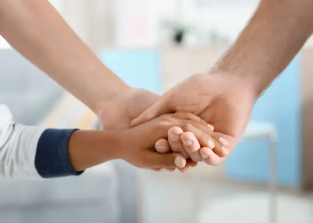 A family holding each others hand