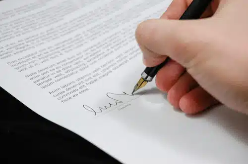 Legal Complexities and challenges in adoption: Hand signing a legal contract