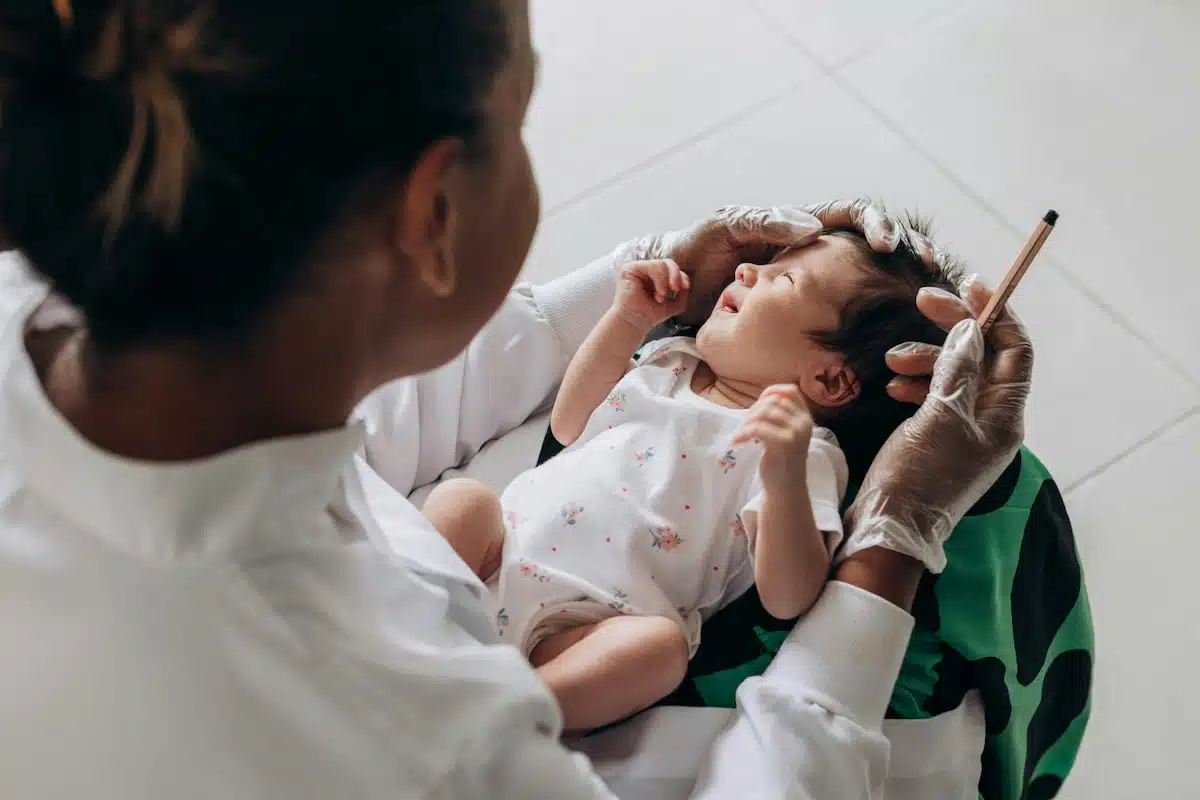 A nurse holding a baby