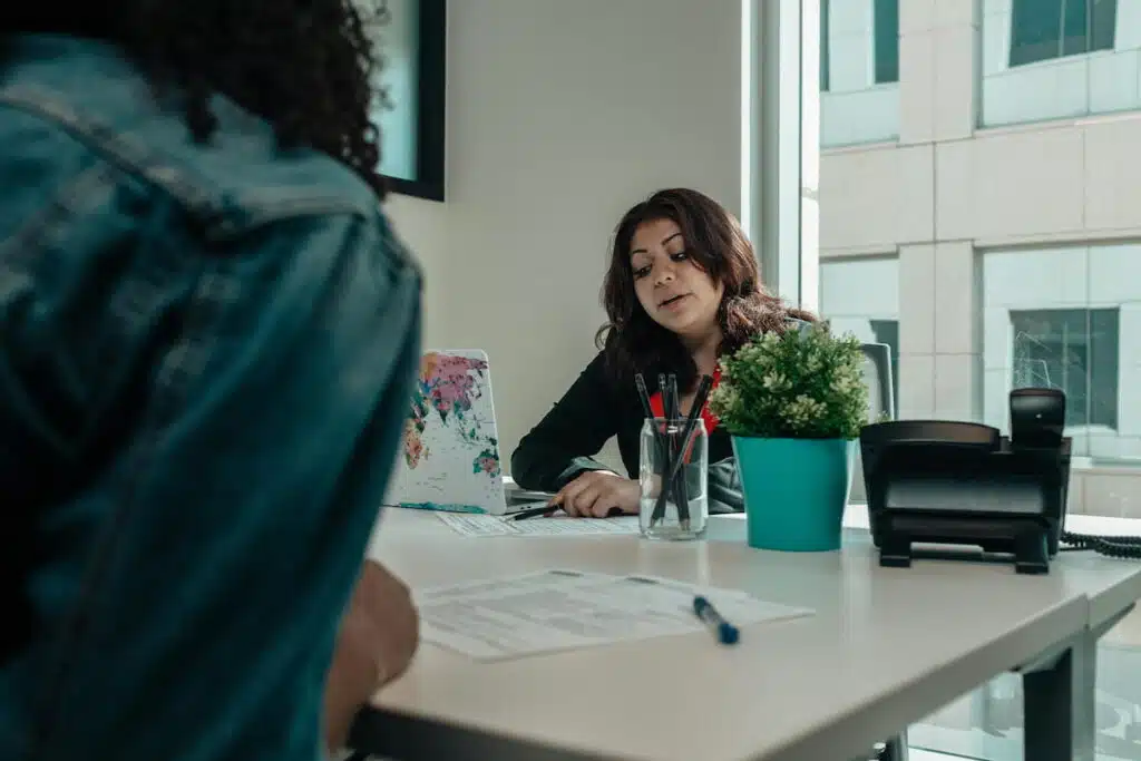 pregnant woman talking to an adoption agency