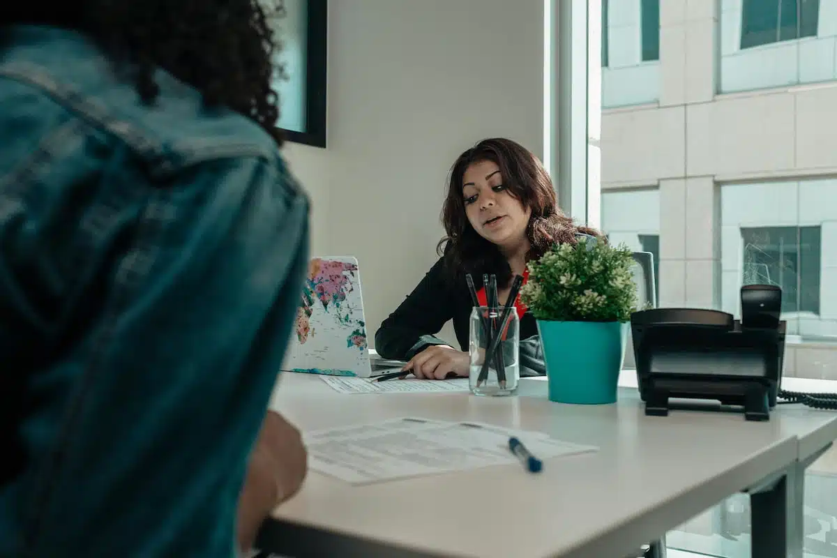 pregnant woman talking to an adoption agency