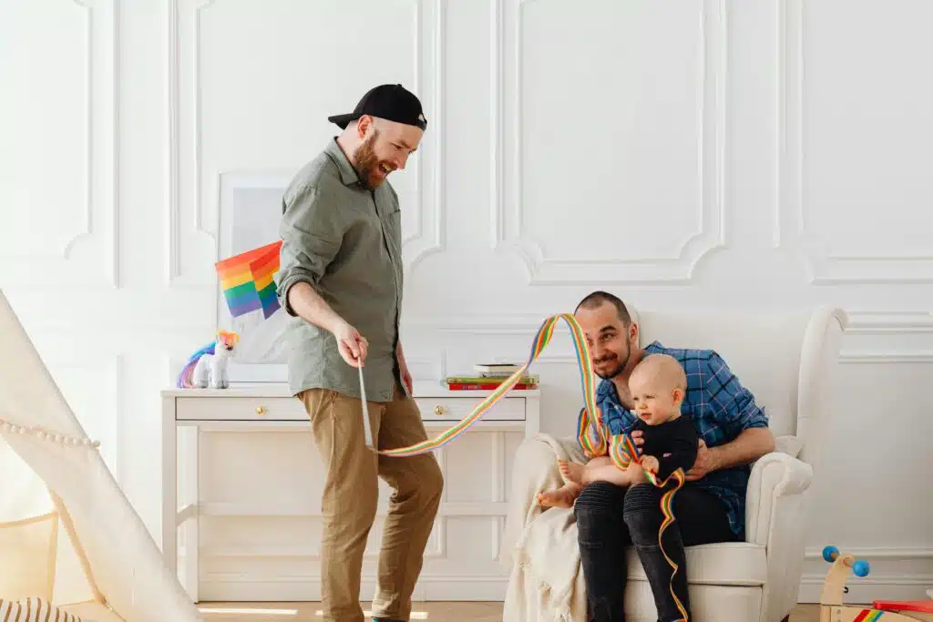 LGBT playing with their adopted child